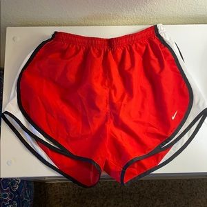 Red Nike running shorts